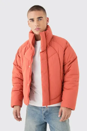 Boxy Abstract Quilted Funnel Neck Puffer In Rust