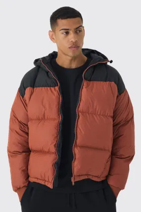 Boxy Curved Quilted Color Block Hooded Puffer In Rust